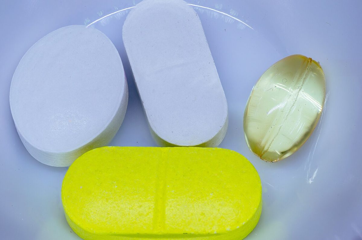 A collection of generic medicine pills on a white background.jpg