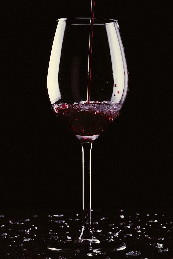 A glass of wine with broken glass